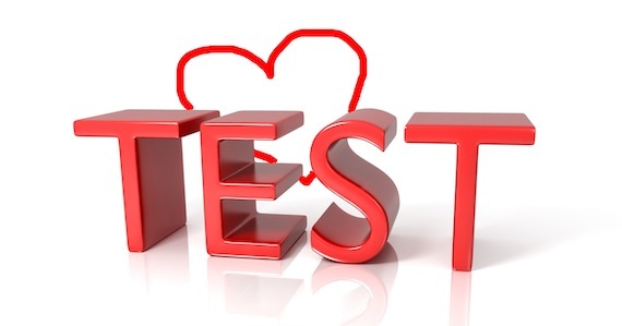 Red 3D text spelling "TEST" with heart.