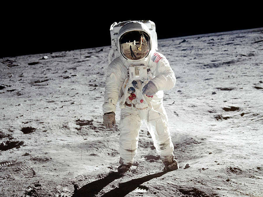 Astronaut walking on the moon's surface.