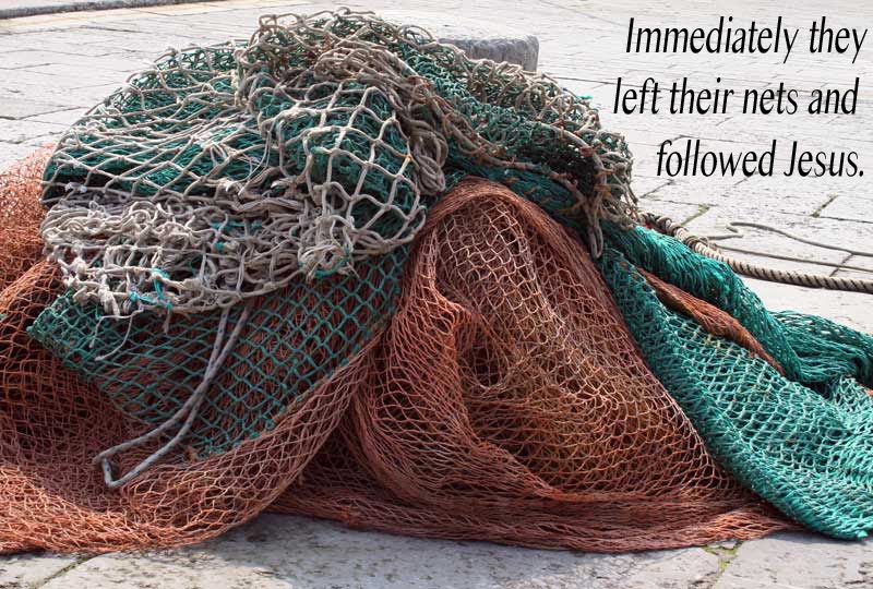 Colorful fishing nets on a stone surface.