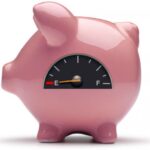 Pink piggy bank with empty fuel gauge.