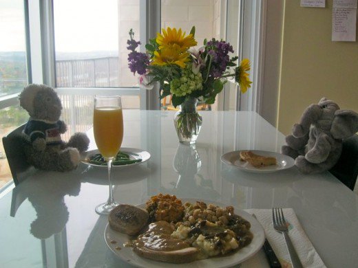 Teddy bears and elephants with breakfast table.