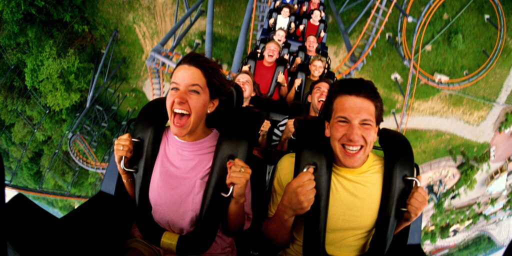 Thrilling roller coaster ride with laughing friends.