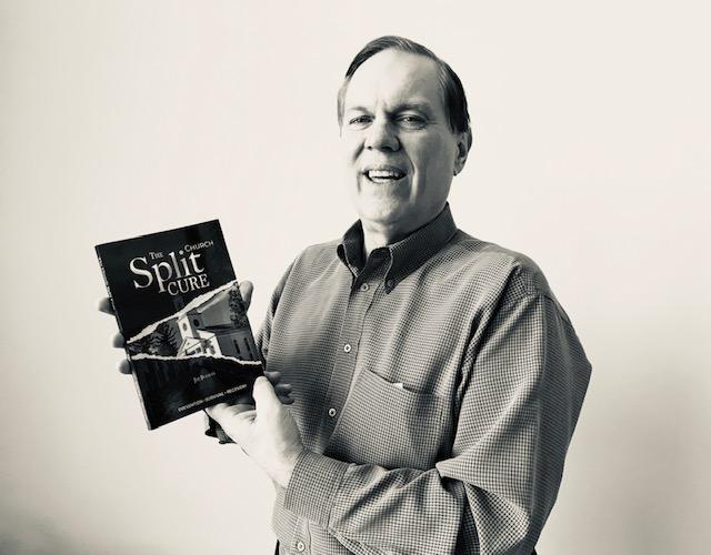 Man holding book titled "The Split Cure."