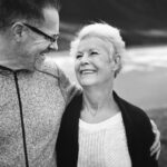 Smiling couple enjoying a joyful moment together.