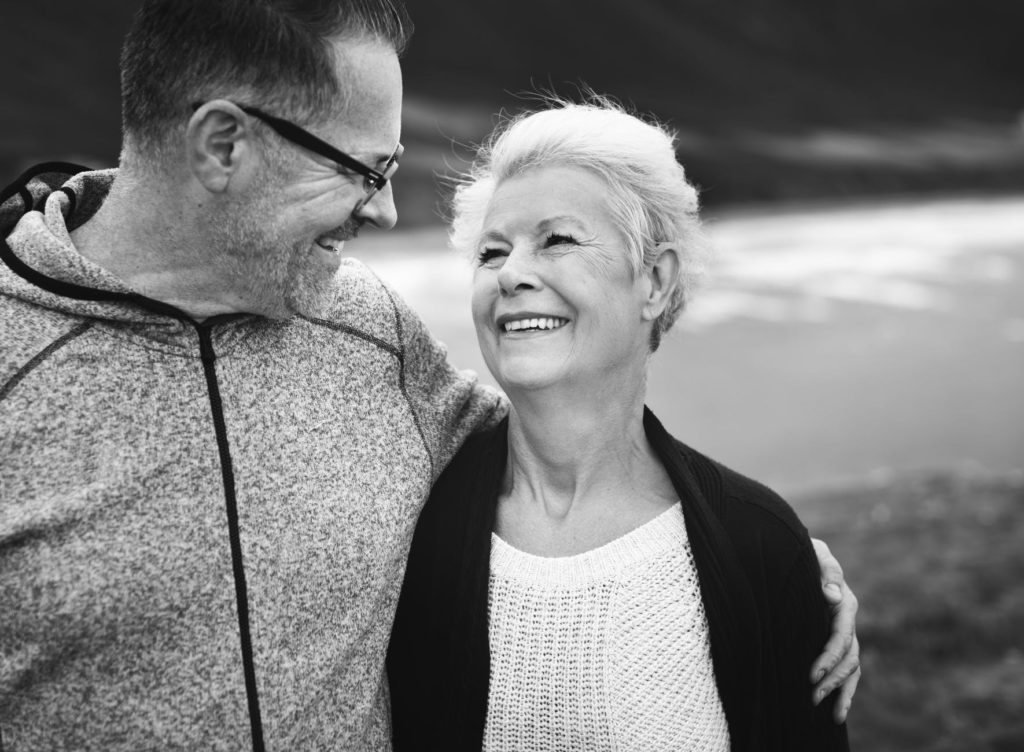 Smiling couple enjoying a joyful moment together.