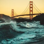 Golden Gate Bridge with ocean waves.