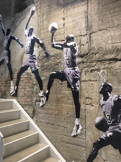 Basketball mural on a concrete wall.