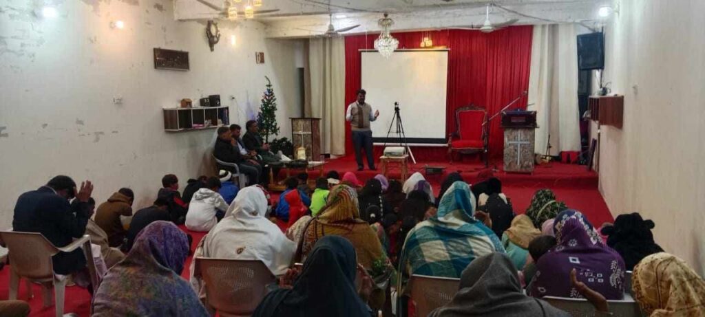 Group gathering in a red-themed indoor space.